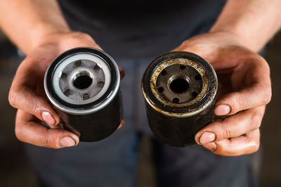 Close-up of man holding coffee cup