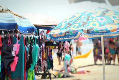 Clothes and parasols at beach