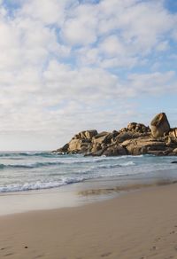 Scenic view of beach and sea against sky