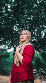 Portrait of a beautiful young woman looking away