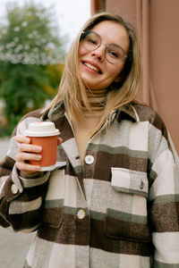 Portrait of a woman drinking coffee