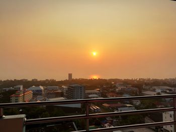 Cityscape against sky during sunset