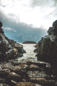 Scenic view of waterfall against sky