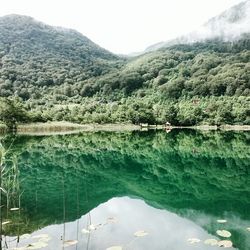 Scenic view of lake with mountains in background