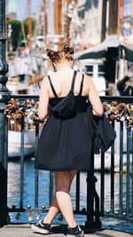 Rear view of woman standing in traditional clothing