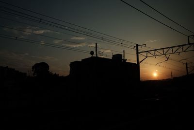 Low angle view of electricity pylon against sky