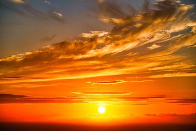 Scenic view of dramatic sky during sunset