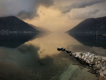 Scenic view of lake against sky during sunset