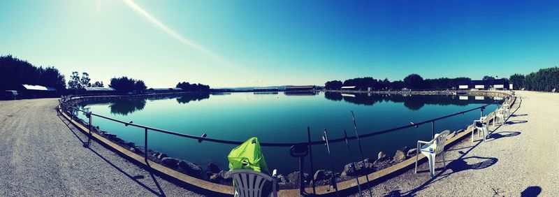 Panoramic view of river against clear blue sky