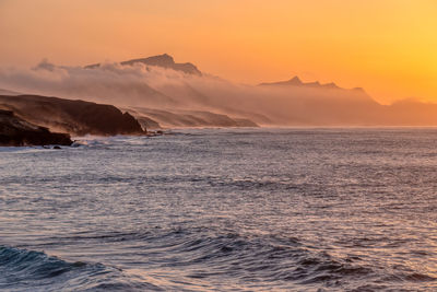 Clouds, fog and waves in twilight