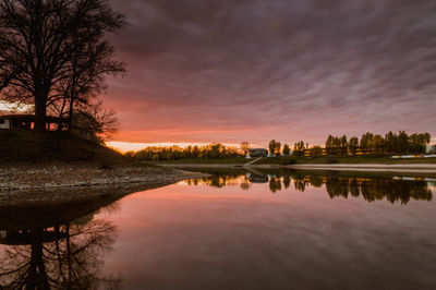 Scenic view of lake against cloudy sky