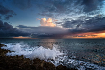 Scenic view of sea against sky during sunset