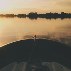 Scenic view of calm lake at sunset