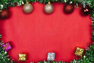 Close-up of christmas tree against wall