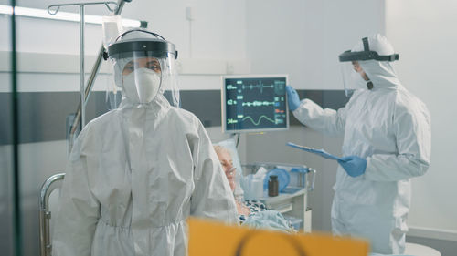 Doctor wearing hazmat suit in hospital