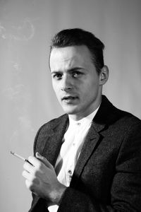 Young man smoking cigarette