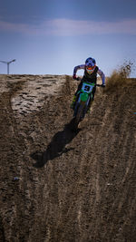 A motocross rider from kawasaki team kuwait during a race.