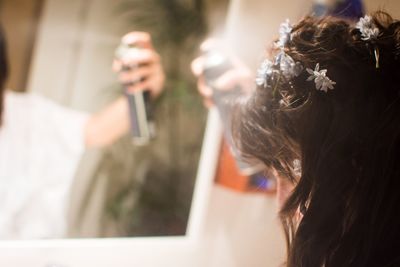 Close-up of woman wearing flowers