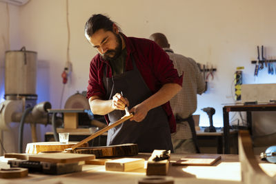 Side view of man working at home