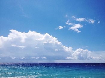 Scenic view of sea against cloudy sky