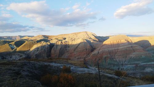 Rock formations on landscape against sky