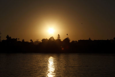 Scenic view of lake at sunset