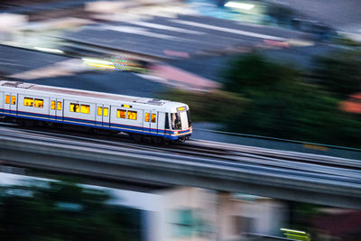 Train on railroad tracks in city