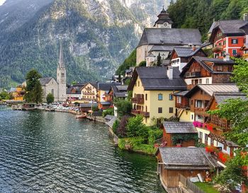 Town by river and buildings in city