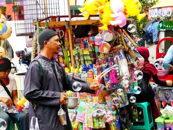 Full length of woman standing in market