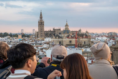 High angle view of people on buildings in city