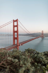 View of suspension bridge against clear sky