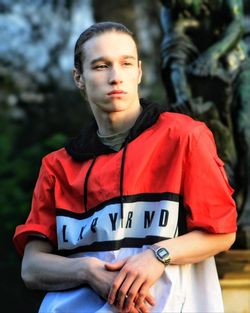 Portrait of young man standing in park