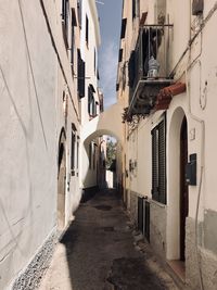 Narrow alley amidst buildings in city