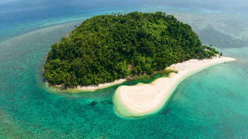 Top view of island in the blue sea with atoll and the beach. agutaya island, philippines.