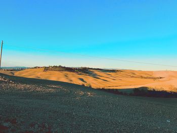 Scenic view of landscape against clear blue sky