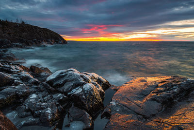 Scenic view of sea against sky during sunset