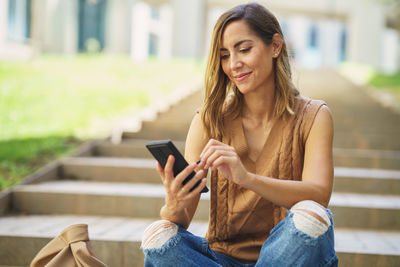 Young woman using mobile phone