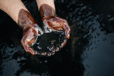 Close-up of hand holding water