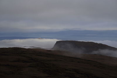 View of landscape against cloudy sky