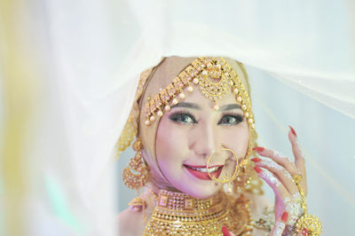 The beautiful and attractive indonesian version of india's face photo, at a party.