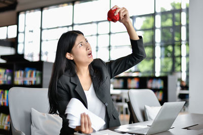 Businesswoman wearing blazer working in office