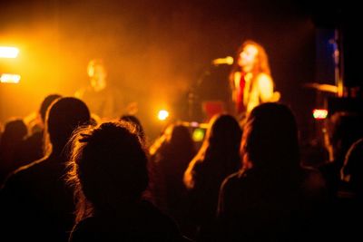 Rear view of people enjoying music concert