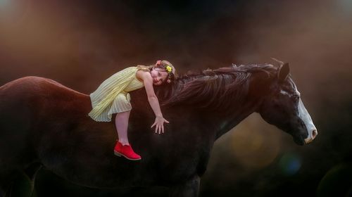 Portrait of girl horseback riding