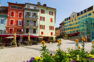 Street amidst buildings in city against sky