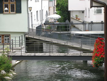 Canal by buildings in city