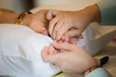 Close-up of baby holding hands