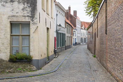 Footpath amidst buildings in town