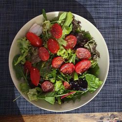 High angle view of strawberries in bowl on table