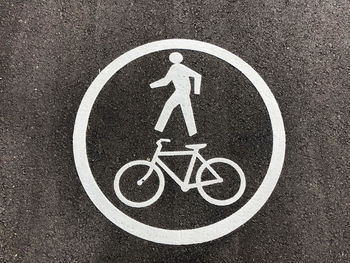 High angle view of bicycle sign on road