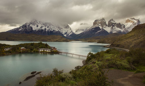 Scenic view of lake and mountains against sky